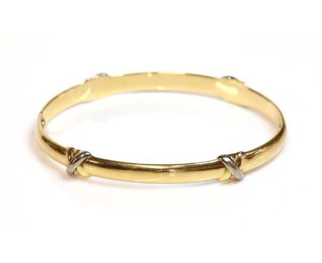A Cartier three colour gold 'Trinity' bangle,with two 'D' section halves, with applied trinity bands, screws deficient. Swiss