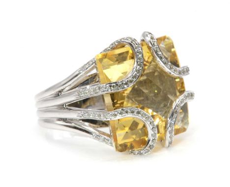 A white gold citrine and diamond ring, attributed to Amanda Wakeley, c.2007,with a square chequer cut citrine, set at each co