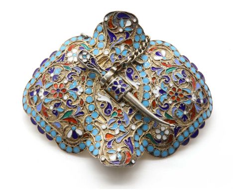 A Russian silver gilt cloisonné enamel belt buckle,later converted to a brooch. The shield form buckle with polychrome cloiso