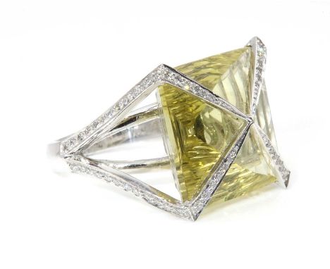 A white gold lemon quartz and diamond ring, attributed to Amanda Wakeley, c.2007,with a square pyramid laser cut lemon quartz