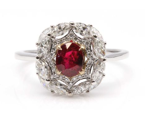 An unheated Burmese ruby and diamond oval cluster ring,with an oval mixed cut ruby, with a weight of 1.02ct, four claw set in