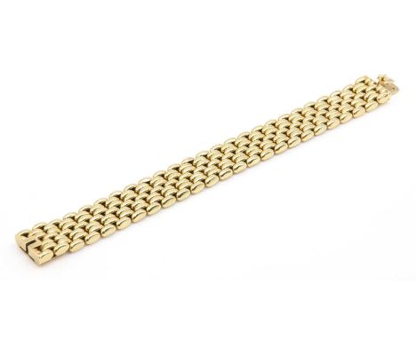 An 18ct gold seven row panther style bracelet, c.1960,with elliptical links to a concealed box clasp, with a fold down safety
