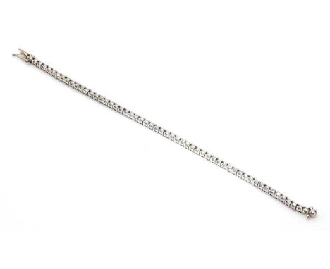 A Continental diamond line bracelet,with a row of brilliant cut diamonds, all four claw set in articulated square collets. An