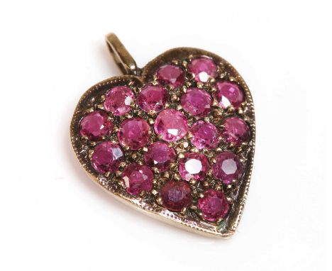 A 9ct rose gold ruby set heart pendant, c.1970,with circular mixed cut rubies, pavé set to a lightly domed heart with a mille