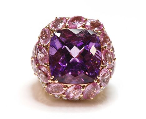 An Italian rose gold amethyst, pink sapphire and diamond bombé style cocktail ring,with a cushion cut amethyst, double claw s