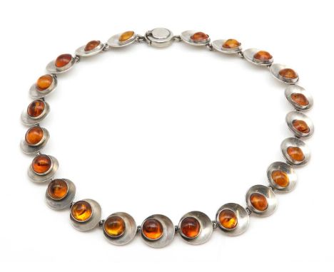 A Danish sterling silver and amber necklace, by Niels Erik From,with a series of circular concave disc style links, each one 