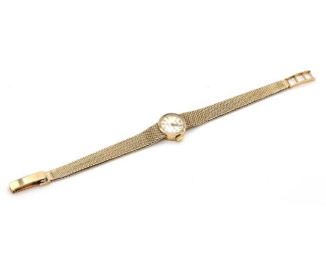 A ladies' 9ct gold Rolex mechanical bracelet watch, c.1959,with 15mm case. A circular silvered dial, with raised gilt batons 