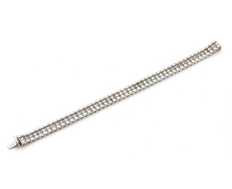 A diamond set bracelet,with a row of arched links and a row of brilliant cut diamonds, claw set to the centre, with a conceal