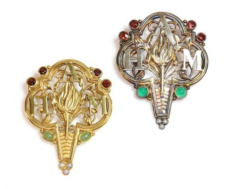 An Arts &amp; Crafts silver 'Association of Headmistresses' brooch,with an open trefoil top and tapered base. A flaming torch