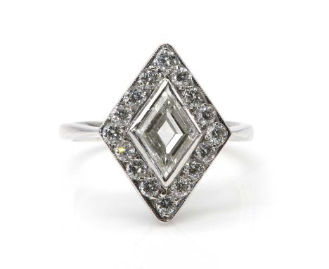An Art Deco style lozenge cluster ring,with a kite cut diamond, with an estimated weight of 0.80ct, rub set to a halo frame o