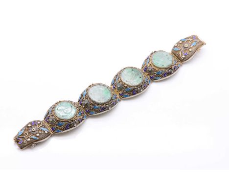 A Chinese silver gilt filigree, jade and enamel bracelet,carved jade discs bezel set to the centre of filigree panel links, w