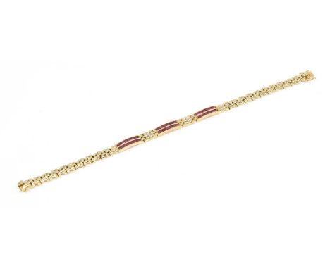 A Continental ruby and diamond bracelet,with a centrepiece composed of three arched bars, each channel set with two rows of c