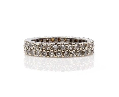 A two row diamond set full eternity ring,with brilliant cut diamonds, claw set to a flat section band. Tested as approximatel