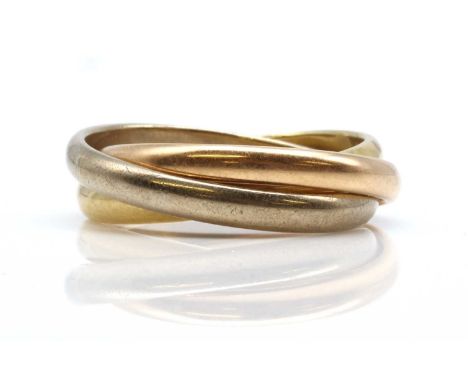 A three colour Russian wedding ring,composed of three 2.70mm bands. Egyptian assay marks for 18ct gold standard. 7.83g.Finger