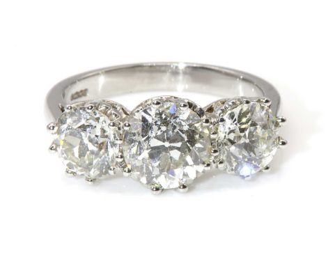 A platinum three stone diamond ring,with three graduated old European cut diamonds, with stated weights of: centre stone 1.75