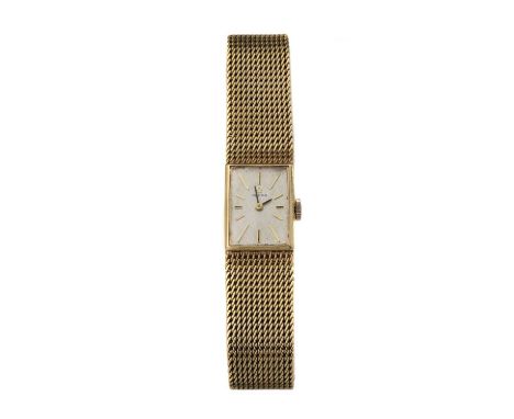 A ladies' 9ct gold Omega mechanical bracelet watch, c.1960,with a rectangular case 18.20 x 14.37mm. A silvered Florentine dia