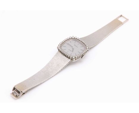 A ladies' white gold Certina diamond set quartz bracelet watch, c.1980,with a cushion shaped case 27.50mm diameter, with a br