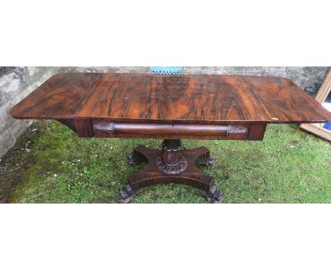 A 19th century rosewood sofa table raised on a platform base