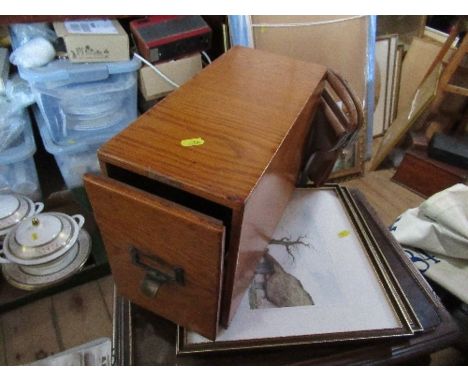 A wooden file drawer, together with a shooting stick and a pair of colour prints