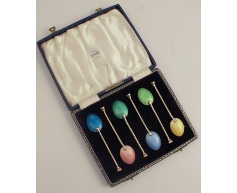 A cased set of six hallmarked silver and enamel bowl back coffee spoons, each with different coloured enamel backs