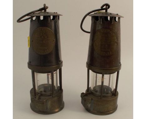 The Protector Lamp &amp; Lighting Co. Ltd Eccles Miners lamp, type SI number 46, together with another by the same maker
