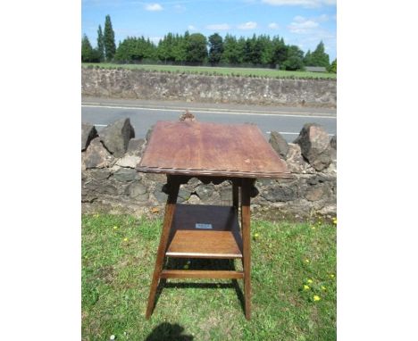 An Arts and Crafts style square topped side table, raised on outswept legs united by a shelf, bearing an ivorine label, ABMA 