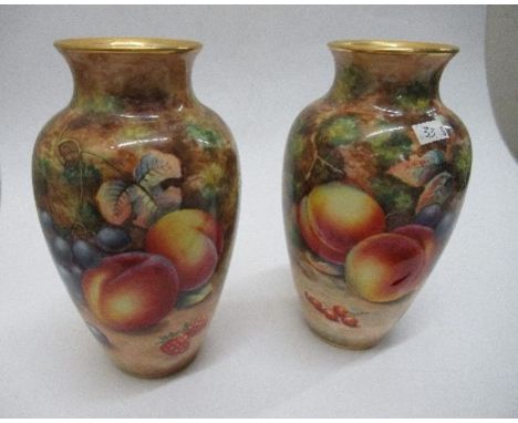 A pair of Royal Worcester vases, decorated all around with hand painted fruit by Higgins, shape number 2227, height 7ins PLEA