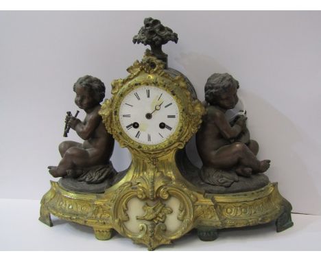 19th CENTURY FRENCH MANTEL CLOCK, gilt scroll design drum shaped mantel clock with putti musicians, 12" height 