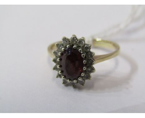 9ct YELLOW GOLD RED &amp; WHITE STONE CLUSTER RING, principal oval cut red stone possibly garnet, surrounded by white stones,