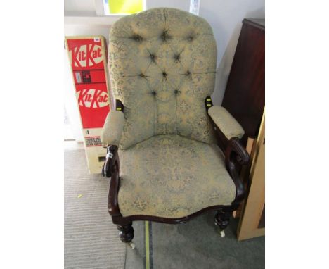 VICTORIAN BUTTON BACK OPEN ARMCHAIR, carved mahogany scroll arms with serpentine fronted seat and original castors 