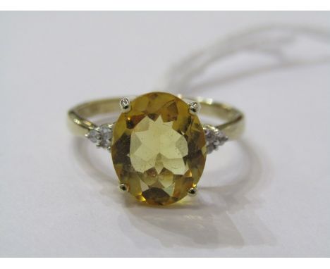 9ct YELLOW GOLD YELLOW CITRINE &amp; DIAMOND RING, pricipal oval cut citrine in excess of 2ct, with accent diamonds to each s