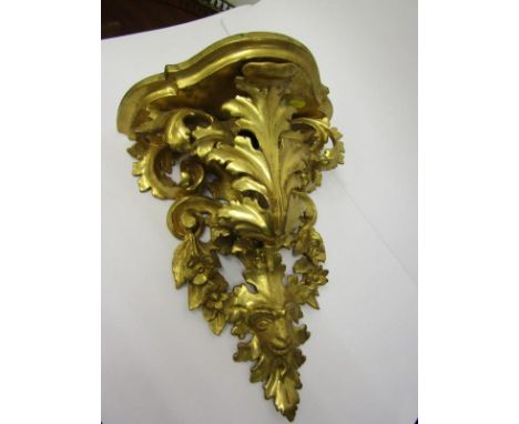 ANTIQUE BRACKET SHELF, carved gilt wood foliate and ram's head mask detailled bracket shelf, 14" height 