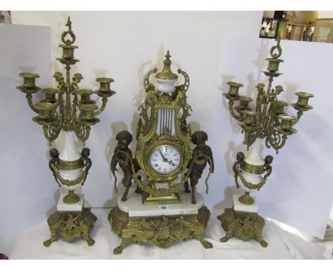 CLOCK GARNITURE, an ornate brass 3 piece clock garniture with Pan figure, garland supports and 6 branch candelabras, 24" heig
