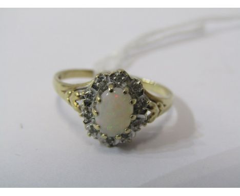 9ct YELLOW GOLD OPAL &amp; DIAMOND CLUSTER RING, principal oval cut opal surrounded by accent brilliant cut diamonds 