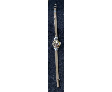 A vintage ladies jewelled gold wristwatch stamped 18k 750 to the back, the circular face stamped Mirvaine and covered by a je