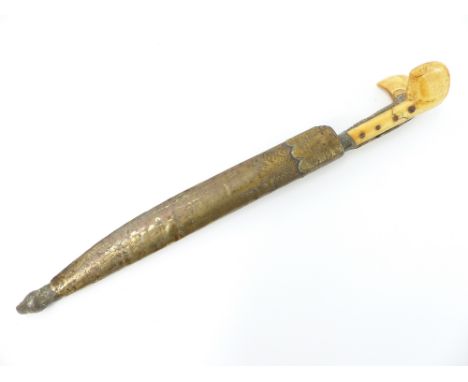 19th century Bichaq dagger, possibly Ottoman, the ivory handle with white metal inlay, with a steel blade and brass scabbard,