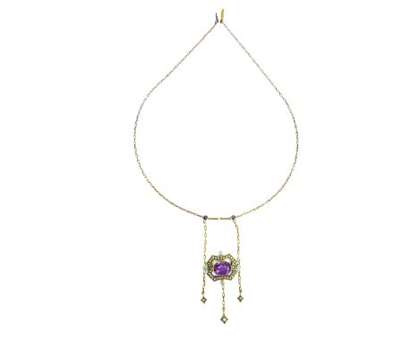 An antique amethyst and seed pearl necklace in yellow metal, the central oval cut amethyst stone surrounded by a shield shape