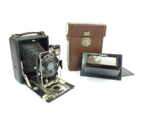 Houghton Butcher camera with Compur shutter and Aldis Anastigmat 4.6 lens, together with a photograph plate and tan leather c