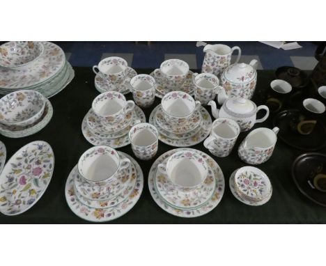A Collection of Minton Haddon Hall Teawares to Include Various Cups, Saucers and Mugs, Two Teapots, Two Milk Jugs etc 