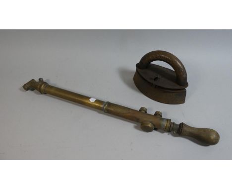 A Vintage Oval Flat Iron and a Brass Garden Spray 