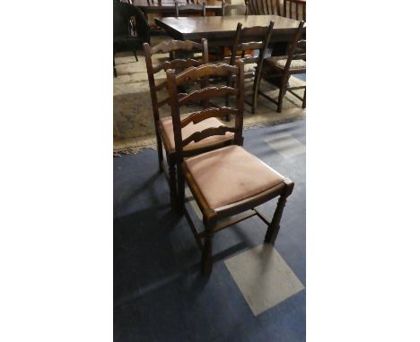A Pair of Ladder Back Chairs and a Nest of Two Tables 
