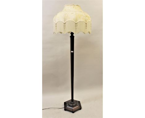 1920's Mahogany hexagonal tapering standard lamp on low bun supports, with cream damask tasselled shade 