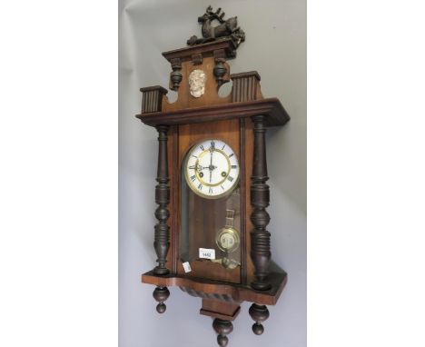 Small Vienna wall clock, the enamel dial with Roman numerals, with a two train movement striking on a gong, 29ins high 