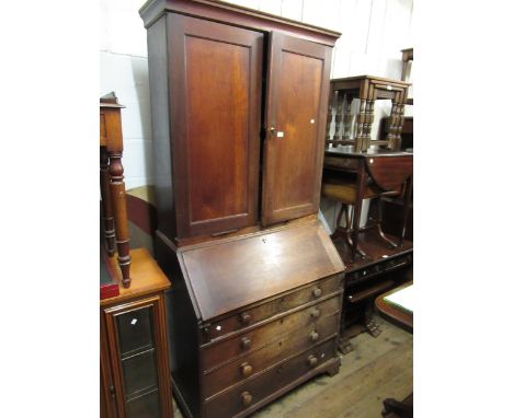 George III mahogany bureau bookcase, the moulded cornice above a pair of panelled doors and pair of candle slides, the base w
