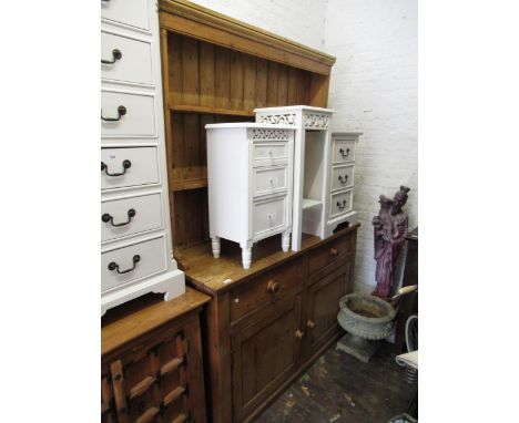 Stripped pine dresser, the boarded shelf back above two drawers and two panel doors with knob handles, above a plinth base, 5