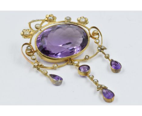 Edwardian gold pendant set oval amethyst surrounded by seed pearls and further amethyst and seed pearl drops 