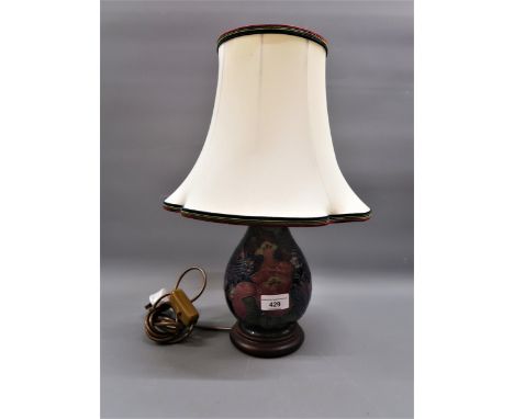 Modern Moorcroft baluster form table lamp decorated with bird and grape design, 7.5ins high, with original shade and hardwood