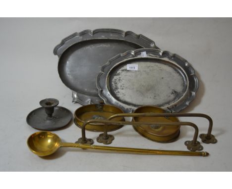 Oval pewter platter, another larger (at fault), pewter chamber stick (at fault), brass ladle, two brass dishes and its two br