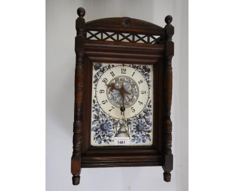 Late 19th Century Continental walnut mantel clock, the porcelain dial painted with flowers, with a single train movement insc
