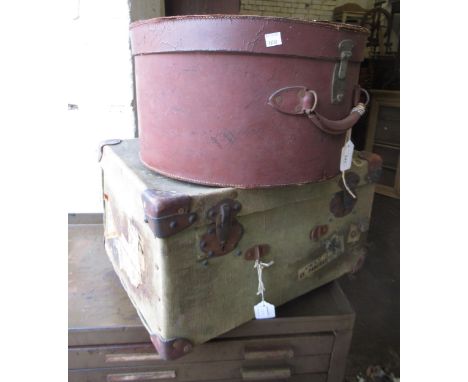 Late 19th / early 20th Century circular leather hat box with brass lock, and another green canvas small trunk with leather co